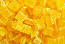 Diced Mango Dried Fruits Texture Background, Top View. Dehydrated Mango Chips Dices, Sweet Food Closeup. The Sight Of Candied Mango Up Close Is A Feast For The Eyes