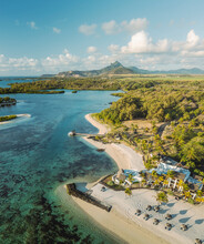 Aerial View Of A Beautiful Beach Along The Coast With Mountain In Background In Ilot Lievres, Flacq, Mauritius.