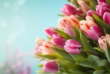 Fototapeta Tulipany - spring flowers banner. bunch of pink tulip flowers on blue sky background. generative ai.