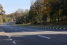 A Section Of Highway With Fresh Road Markings. City Park Area. The Bike Path Runs Along The Highway.