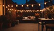 Cozy outdoor terrace view with string lights and lanterns on beautiful house roof in autumn evening