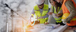 © SOMKID - Future building construction engineering and technology project concept. double exposure graphic with engineer using digital tablet and smart industry and IOT software to control operation.