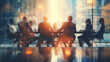 © Malambo/Peopleimages - AI - Silhouette of group of business people having a meeting or brainstorming in a boardroom