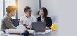 © SOMKID - Business people working in team conference with project planning document on meeting table office.