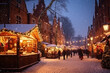 Christmas market in old town square at snowy evening. People walking the street.