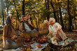 © bernardbodo - Whole family having a picnic in the forest