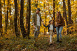 © bernardbodo - Mother, father and their daughter having a walk trough the forest