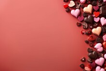 Valentine's Chocolate Border With Red And Pink Hearts. Overhead View On A Red Paper Banner Background, Providing Space For Copy. Generative AI