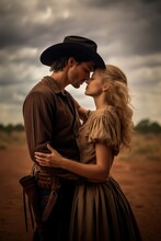 Wild West Vintage Retro Noire Couple In Love. Kissing Valentines Couple. Cowboy Hat. Leather Outfit. Passionate Couple. Blond Woman. Delicate Amish Woman Wearing A Dress. Holster. Farm Background. 