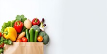 Healthy Food In Paper Bag Vegetables And Fruits On White Background.