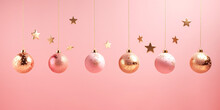 Christmas New Years Greeting Card Banner With Ornament Balls Hanging On Chain On Pink Background. Template With Copy Space