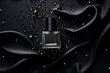 Abstract black perfume bottle on black cloth background