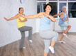 © JackF - Three elderly women are learning sports Latin American dances in studio class. Joint pastime, active hobby