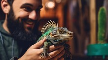 A Reptile Enthusiast Interacts With Their Exotic Pet, Demonstrating The Fascination And Affection That Can Exist In The Unique Bond Between Humans And Reptiles.