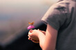 © kieferpix - Little child holding flower with butterfly. environmental education, I love nature concept