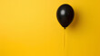 Black balloon with yellow background. Black Friday and Cyber Monday. 
