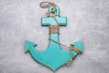 Canvas Print - Wooden anchor with hemp rope on light grey table, top view