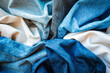Varuous shades and colors of denim fabrics. Denim texture background.
