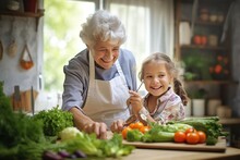 grandmother and granddaughter girl cooking vegetables and smiling together in the kitchen; old lady and child preparing vegan salad; senior woman with little kid having a healthy vegetarian food