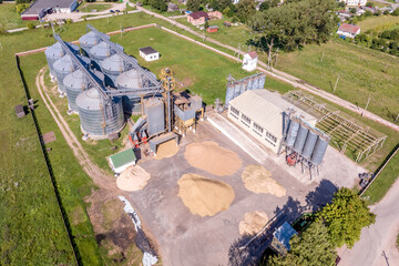 Wall Mural - aerial panoramic view on agro-industrial complex with silos and grain drying line