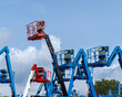 © Matteo Ceruti - Group of aerial work platforms for construction and material handling. Close-up to the basket for moving people