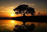 Fototapeta  - Silhouette of tree against water, captured at sunset or sunrise. Generative AI