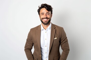 Wall Mural - Handsome man with beard smiling and looking at camera on white background