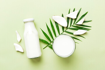 Wall Mural - coconut products on white wooden table background. Dairy free milk substitute drink, Flat lay healthy eating