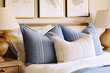 © Amornrat - Elegance in Simplicity Blue Pillows Adorn a Modern Bedroom in French Country Style. created with Generative AI