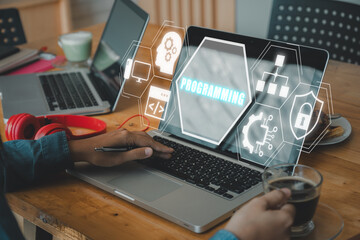 Wall Mural - programming concept, person working on laptop computer with programming icon on virtual screen.
