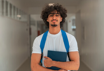 Wall Mural - Portrait of a male college student on a university campus.