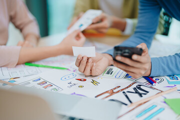 Wall Mural - Team of Creative Web, Graphic Designer planning for mobile phone, drawing website ux ui app for mobile phone application and development template layout, process to developing prototype wireframe.