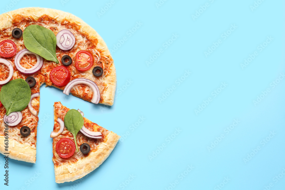 Tasty pizza with basil and tomatoes on blue background