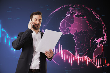 Sticker - Attractive thoughtful young european businessman with document talking on the phone on blurry background with glowing falling red forex chart and globe. Global economy, recession and crisis concept.