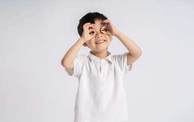 Portrait of asian boy posing on white background