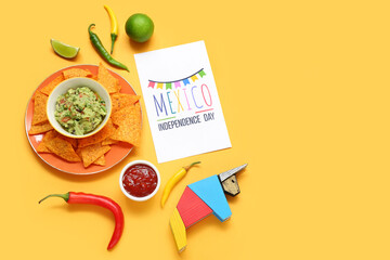 Wall Mural - Greeting card with text MEXICO INDEPENDENCE DAY, Mexican food and sombrero on orange background