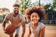 © VisualProduction - African american dad and daughter playing basketball. Father teaching daughter to play basketball. Family doing sports together and being active.
