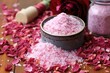 pile of bath salts with dried rose petals on wooden surface