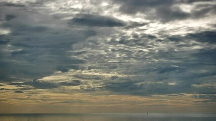 Wall Mural - time-lapse sunrise cloudscape tropical weather, colorful sky, and rain clouds at the horizon.