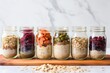 diagonally placed jars of oats with variety of toppings
