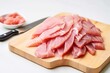 sliced raw tuna on a white board