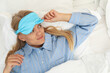 © Atlas - A young woman wearing a sleeping mask has just woken up