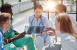 © Katsiaryna - Group of Doctors and nurses Concept Teamwork in hospital for success work and trust in team