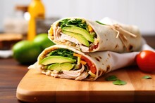 Subway Style Sandwich With Avocado And Turkey In A Napkin