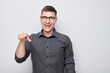 © amixstudio - Portrait of confident man chooses you points finger at camera isolated on white studio background. Welcome gesture, join our team concept.