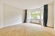 © ADDICTIVE STOCK - Empty room with bay window and radiator