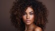 © koplesya - beautiful curly young mulatto with clear, radiant skin. Facial care. Cosmetology, beauty and spa