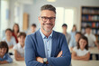 Portrait of a smiling male teacher in an elementary school class, surrounded by attentive students. Perfect for illustrating the joy of teaching and learning.
