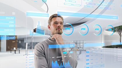 Fototapete - Handsome Man Standing in Futuristic Virtual Space, Interacting with an Augmented Reality Hologram with Business Data, Financial Reports, Stock Market Statistics, Infographics, Charts