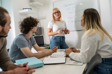 Language professor instructs students in foreign language at a diverse and vibrant language school, fostering linguistic growth and multicultural understanding.